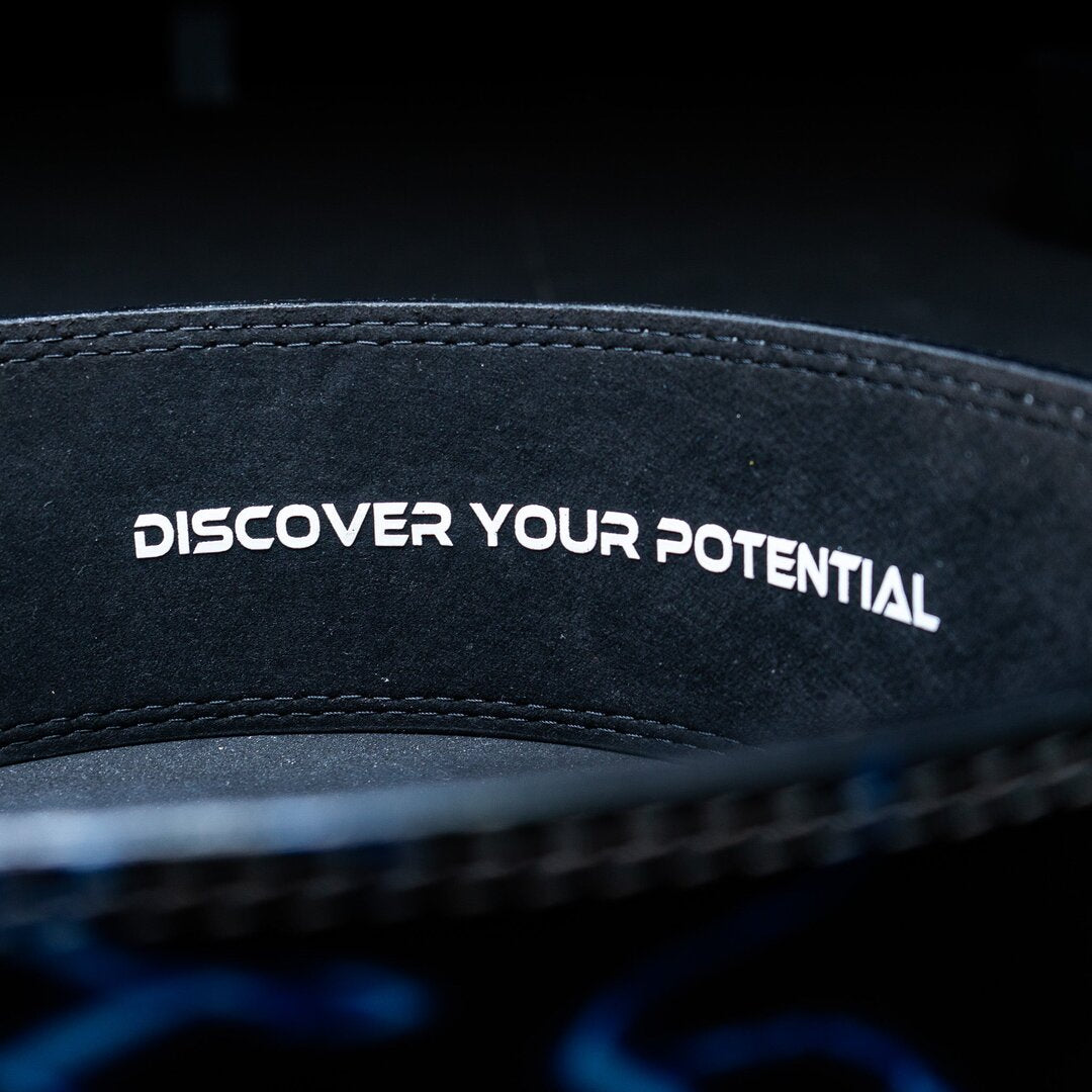 Inside of a blue Unlisted Strength lever belt with the text 'discover your potential