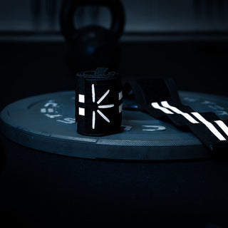 Trackfie wrist wraps lying on a weight plate