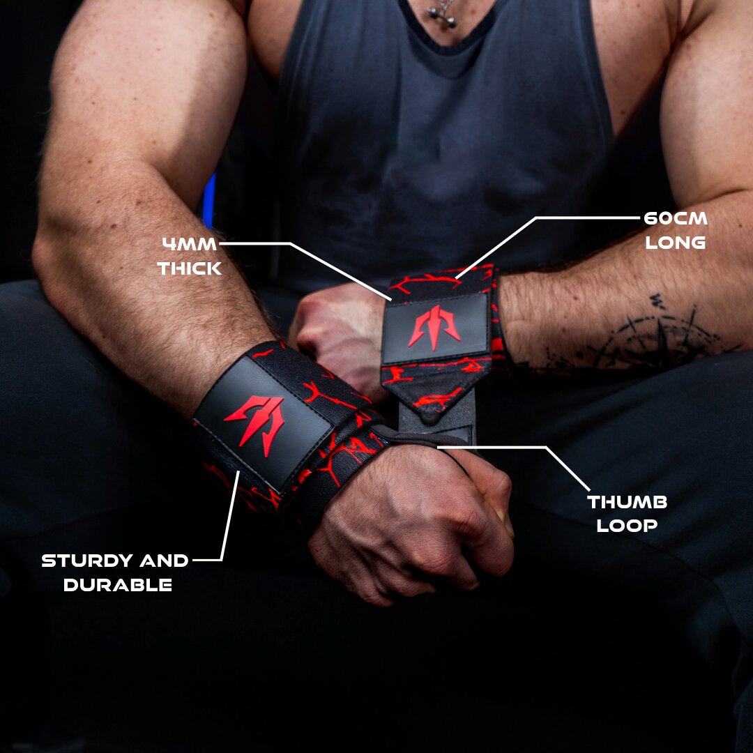 Man tightens his red wrist wraps around his wrist while specifications are highlighted with lines extending from them