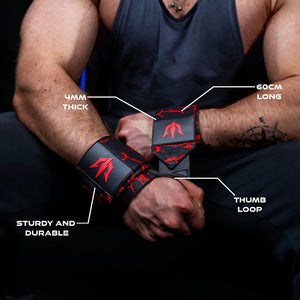 Red Unlisted Strength wrist wraps being tightened around wrists on a man with 4 specifications highlighted with lines extending from the wrist wraps