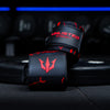 Red Unlisted Strength wrist wraps rolled up